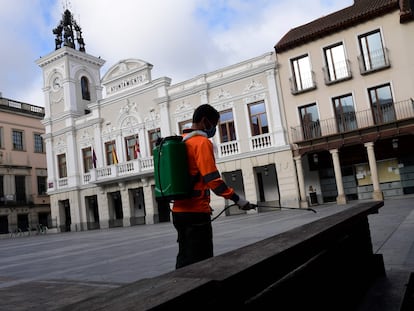 A worker disinfects a square in Guadalajara on Monday.