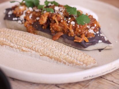 Bean tlacoyo with pressed chicharrón.