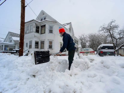 Rocio Franco shovels snow from the open of her driveway on Saturday, March 4, 2023, in Bellow Falls, Vermont.
