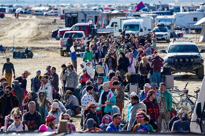 Hundreds of Burning Man attendees who planned to leave on buses wait for information about when they will be able to leave on Labor Day, after a rainstorm turned the site into mud September 4, 2023.