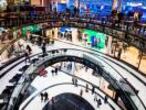 FILE PHOTO - People walk through the Mall of Berlin shopping centre during its opening night in Berlin, September 24, 2014. REUTERS/Thomas Peter/File photo