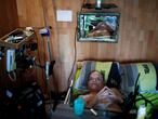 Alain Cocq, 57, in his medical bed he has been confined to for years as a result of a degenerative disease that has no treatment, poses after an interview with Reuters at his home in Dijon, France, August 19, 2020. Picture taken on August 19, 2020. REUTERS/Gonzalo Fuentes     TPX IMAGES OF THE DAY