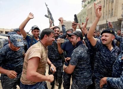 Iraqi Federal police celebrate in the Old City of Mosul, Iraq, July 8, 2017. Ahmed Saad: "This is the first moment of Iraqi soldiers expressing their joy and relief at the end of a brutal, nearly nine-month-long battle in which they lost many of their comrades. I went to see the celebrations when we heard that combat operations had virtually ended and the announcement of final victory in Mosul was about to be made. The soldiers were shooting in the air. Photographers were worried about being hit by falling bullets so stayed in our body armour. But I was happy that we were about to rid this part of the country of Islamic State and citizens could finally return to their homes. Wearing bullet-proof vests and helmets in the searing mid-summer Iraqi heat is physically difficult but it's important to keep safety in mind. It's also difficult to communicate with the commanders to know what's happening. And the travel across rough, rocky desert to reach frontlines is also uncomfortable and there is a lot of waiting. The internet is also bad so it is frequently a struggle to file our pictures to the world in real time. All the same, I enjoy photographing military clashes because the pictures are powerful and expressive." REUTERS/Ahmed Saad/File photo        SEARCH "MOSUL PICTURES" FOR THIS STORY. SEARCH "WIDER IMAGE" FOR ALL STORIES.