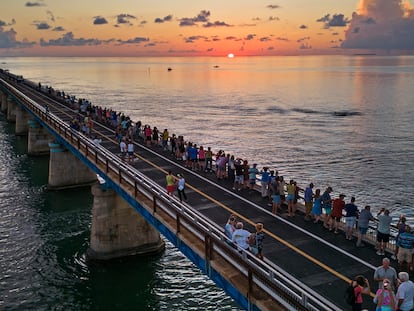 Attendees watch and toast the sunset at a Florida Keys bicentennial celebration