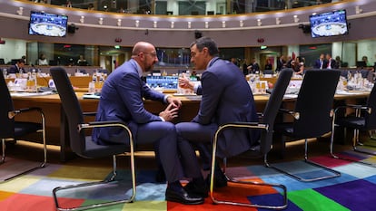 President of the European Council Charles Michel speaks with Spain's Prime Minister Pedro Sanchez at a main meeting room ahead of European Union leaders summit in Brussels on June 23, 2022. 