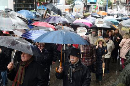 Manifestació a Madrid sota la pluja.