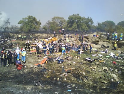 At 2.23pm, the plane was back on the runway. But the pilots fail to deploy the plane’s flaps, which are essential for generating enough lift during takeoff. In the photo, fire crews and emergency services at the crash site.
