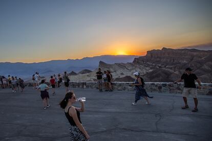 LOS ANGELES, CA - JULY 19 - Tourist watch the sunset at Zabriskie Point in Death Valley National Park on July 19, 2023. California's famous Death Valley, one of the hottest places on Earth, had reached a sizzling 124F (51C) on this afternoon. (Photo by Apu Gomes)