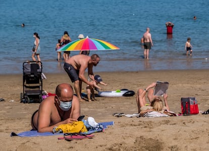 Beachgoers in Las Canteras beach in the Canary Islands on March 31. 
