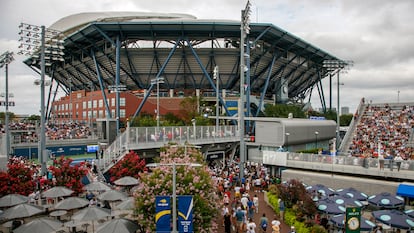 People navigate the grounds in front of Arthur Ashe Stadium during the US Open Tennis Championships at the USTA National Tennis Center in Flushing Meadows, New York, USA, 28 August 2023.