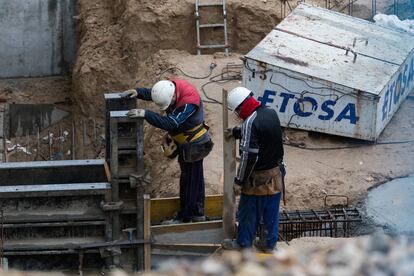 Builders on a construction site in Madrid.