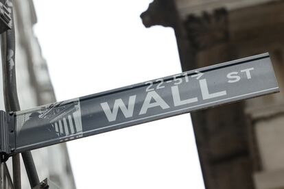 A street sign marks Wall Street outside the New York Stock Exchange (NYSE) in New York City