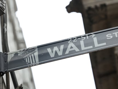 A street sign marks Wall Street outside the New York Stock Exchange in New York City, on February 24, 2022.