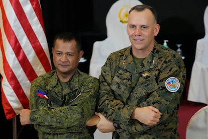 U.S. Marine Corps Major General Eric Austin, right, U.S. exercise director representative, and Philippine Army Major General Marvin Licudin, Philippine exercise director pose after the opening ceremonies of a joint military exercise flag called "Balikatan," a Tagalog word for "shoulder-to-shoulder," at Camp Aguinaldo military headquarters Tuesday, April 11, 2023, in Quezon City, Philippines.