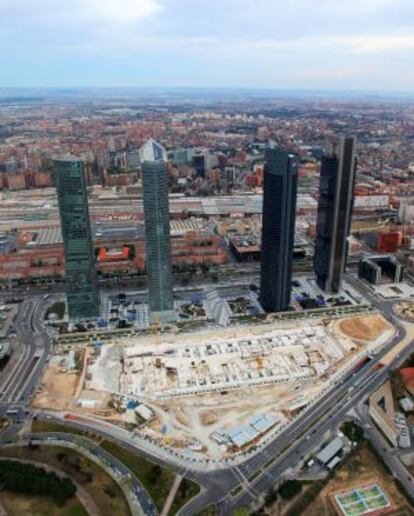 The Cuatro Torres Business Centre, with the foundations of the International Convention Centre visible in the foreground.