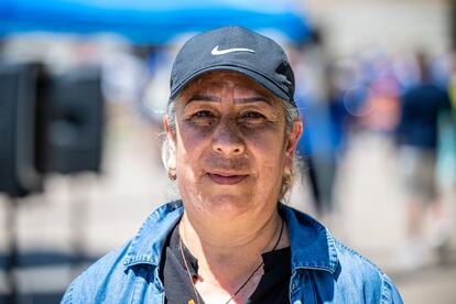 Rosa Rentería poses for a portrait during a protest at the state capitol in Phoenix