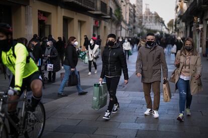 Pedestrians in Barcelona, Catalonia, where worsening coronavirus figures may lead to a revised Christmas coronavirus plan.