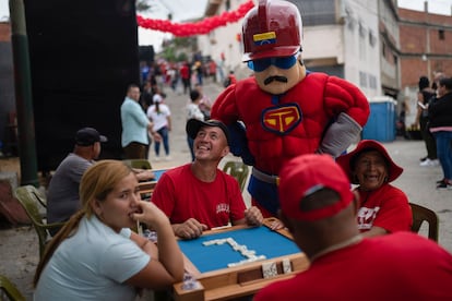 A man dressed as 'Supermoustache', a representation of Maduro as a superhero, on the streets of Caracas, on June 18.