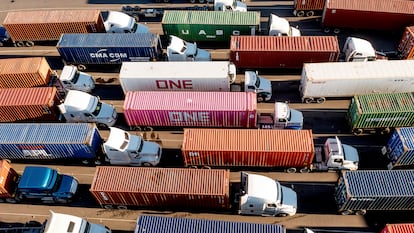 Trucks line up to enter a Port of Oakland shipping terminal on November 10, 2021, in Oakland, California.