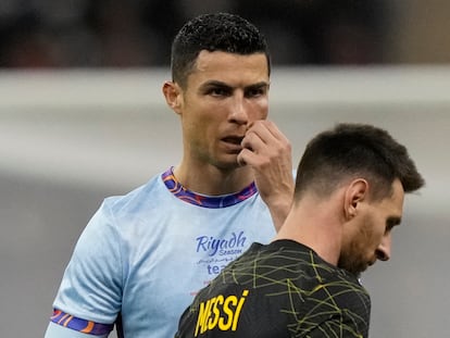 Cristiano Ronaldo gestures playing for a combined XI of Saudi Arabian teams Al Nassr and Al Hilal is flanked by PSG's Lionel Messi during a friendly soccer match, at the King Saud University Stadium, in Riyadh, Saudi Arabia, Thursday, Jan. 19, 2023.