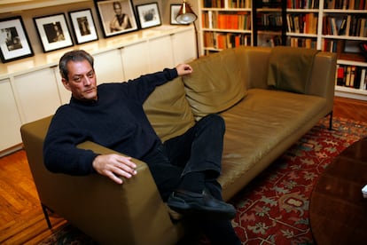 Paul Auster speaks with the press inside his home in Brooklyn, New York.