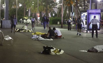 Bodies are seen on the ground after at least 30 people were killed in the southern French town of Nice when a truck ran into a crowd celebrating the Bastille Day national holiday