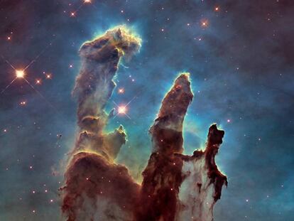 The Pillars of Creation, in the Eagle Nebula 7,000 light years from earth, photographed by the Hubble Space Telescope.