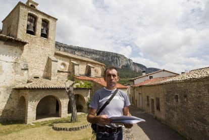 The former mayor of Ziritza with the paperwork covering the buildings in the village.