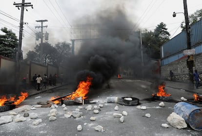 Burning barricade set up in protest against the government and calling for the resignation of Prime Minister Ariel Henry