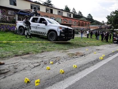 The National Guard officers guard the site of a shootout between police and suspected members of the Sinaloa cartel on July 12, 2022, in Mexico City.