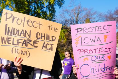 Demonstrators stand outside the U.S. Supreme Court in Washington