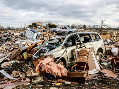 Damaged vehicles and personal property are strewn over a wide area along Kentucky 81, Saturday, Dec. 11, 2021, in Bremen, Ky, after a devastating tornado swept through the area on Friday night. (Greg Eans/The Messenger-Inquirer via AP)