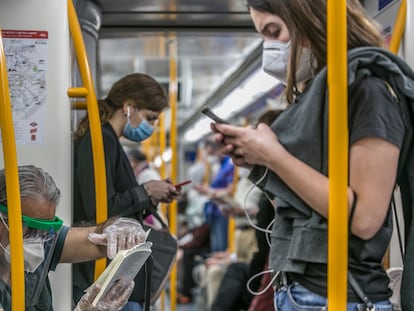 Subway commuters inside the Madrid Metro on June 20.