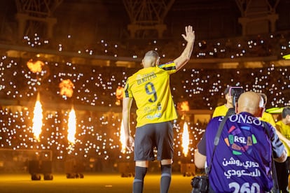 French soccer player Karim Benzema waves to fans during a presenting event after joining Al Ittihad, in Jeddah, Saudi Arabia, 08 June 2023