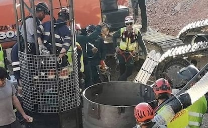 Miners being lowered into the shaft.