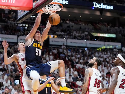 Denver Nuggets forward Aaron Gordon (50)dunks the ball during the first half of Game 4 of the basketball NBA Finals against the Miami Heat, Friday, June 9, 2023, in Miami.