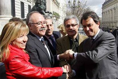 De Madre (PSC), Carod (ERC), López Garrido (PSOE), Saura (ICV) y Mas (CiU), tras la votación del Estatuto.