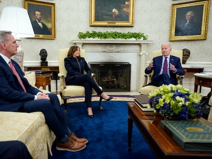 Speaker of the House Kevin McCarthy and Vice President Kamala Harris listen as President Joe Biden speaks during a meeting in the Oval Office of the White House, on May 16, 2023, in Washington.