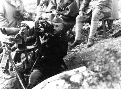 Francisco Franco checking on the working of a camera on January 15, 1939, during the offensive in Catalonia.