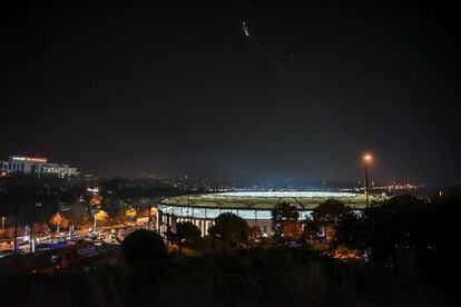 A police helicopter flies over the Vodafone Arena, where a car bomb exploded near the stadium of football club Besiktas, in central Istanbul on December 10, 2016.  
Twenty-nine people, mainly police, were killed and 166 wounded in Istanbul on Saturday when twin bombings struck the heart of the city close to the stadium of top flight football giants Besiktas after a major game. / AFP PHOTO / Ozan KOSE