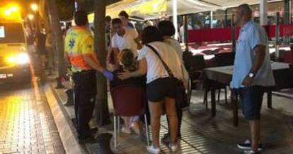 A woman receiving medical assistance following the stampede.