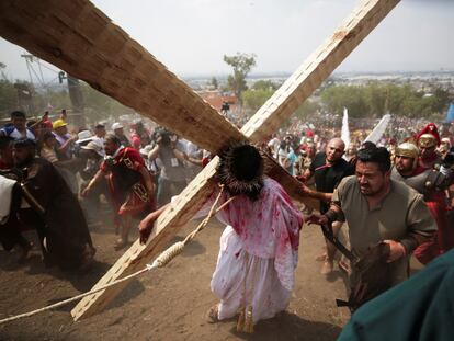 People take part in the re-enactment of the crucifixion of Jesus Christ in Mexico City.