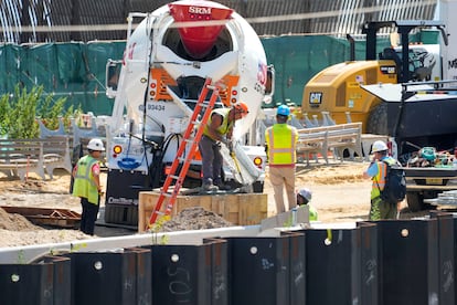 Construction workers are seen pouring concrete at the East Side Coastal Resiliency project, Thursday, July 6, 2023