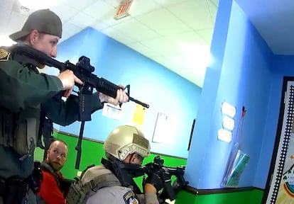 Police deploy in a hallway after Salvador Ramos entered Robb Elementary school to kill 19 children and two teachers in Uvalde, Texas, U.S. May 24, 2022 in a still image from police body camera video.    City of Uvalde Police Department/Handout via REUTERS.  THIS IMAGE HAS BEEN SUPPLIED BY A THIRD PARTY.