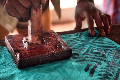 Stamping the fabric by hand