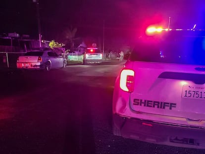 In this image released by Tulare County Sheriff's Office, detectives investigate a shooting in Goshen near Visalia, Calif., early morning Monday, Jan. 16, 2023.