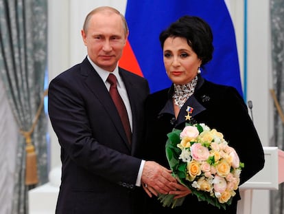 Russian President Vladimir Putin presents a medal to Head of the Russian Rhythmic Gymnastics Federation Irina Viner, in the Kremlin in Moscow, Russia, on May 1, 2015.