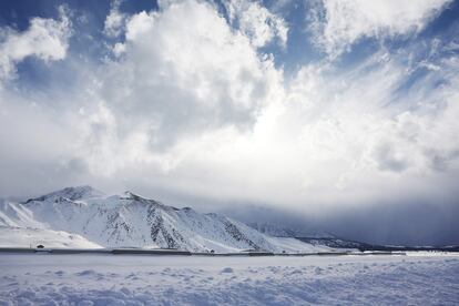 Clouds pass above the snow-covered Sierra Nevada mountains, in California, in the wake of an atmospheric river event, on March 12, 2023