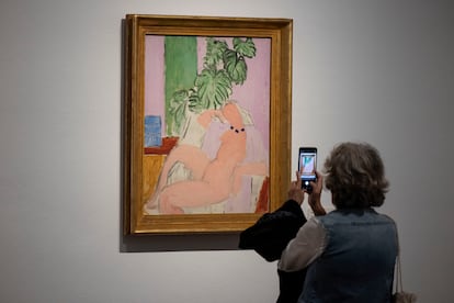 A visitor contemplates one of Matisse's works, in the exhibition.