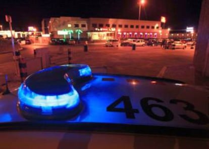 A patrol car guarding the entrance of the sprawling Paradise brothel in La Jonquera.